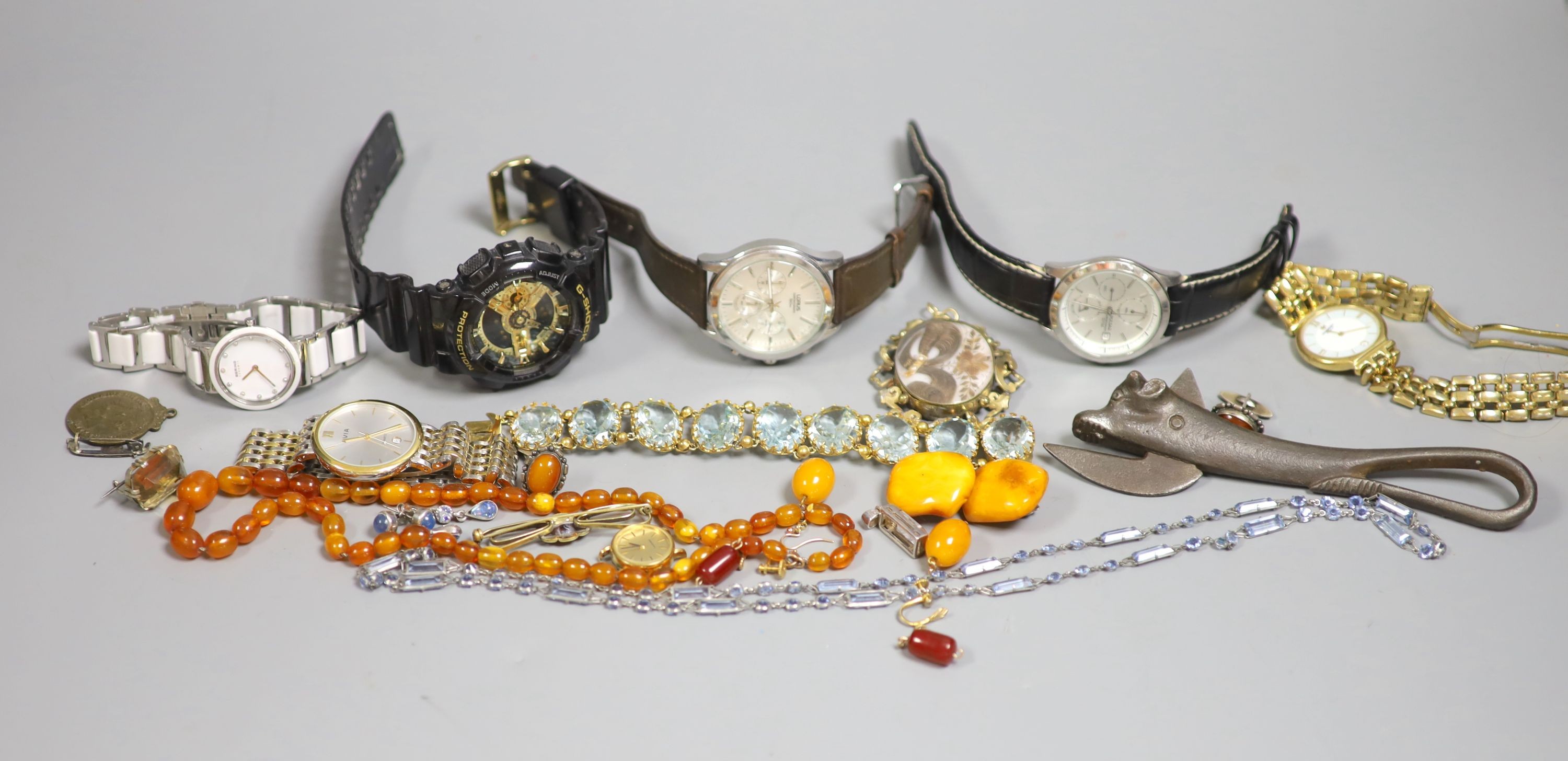 An amber necklace, costume jewellery, watches, etc.